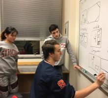 NEXIS students working on a project at Syracuse University