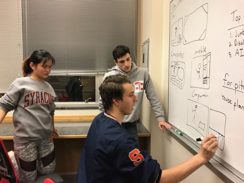 NEXIS students working on a project at Syracuse University
